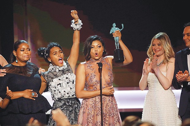 From left, “Hidden Figures” stars Octavia Spencer, Janelle Monae and Taraji P. Henson celebrate winning the SAG award as the top cast in a motion picture. 