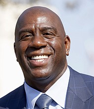 NBA and Lakers Legend Magic Johnson (photo via latimes.com)
