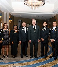 2017 Strong Men & Women honored //Seven high achievers were honored at the 2017 Strong Men & Women in Virginia History program Feb. 1 at a Downtown hotel. 
Gov. Terry McAuliffe, center, celebrates with the honorees during the annual event that Dominion Resources and the Library of Virginia co-sponsor to honor African-American standouts. 
From left, the honorees are: Capt. William E. “Bill” Bailey of Accomack, a decorated military pilot; Virginia Court of Appeals Judge Mary Janipher Bennett Malveaux of Henrico County, the court’s first African-American female member; Dr. Margaret Ellen Mayo Tolbert of Suffolk, influential biochemist and author; and Charles Johnson III, who accepted the award on behalf of his late grandfather, sociologist Charles Spurgeon Johnson of Bristol, the first African-American president of Fisk University.
Also, Optician David Lambert, representing his late father, Dr. Benjamin J. Lambert III of Richmond, a former state senator and optometrist who played a major role in civic affairs; Jeffrey Moten, who honored the memory of his late wife, Stephanie Therese Rochon-Moten of Richmond, award-winning television reporter and news anchor; and Zakia Al-Amin, who stood in for her grandfather, pioneering Virginia pharmacist Leonard “Doc” Muse of Arlington, who owned and operated Green Valley Pharmacy for 65 years. 