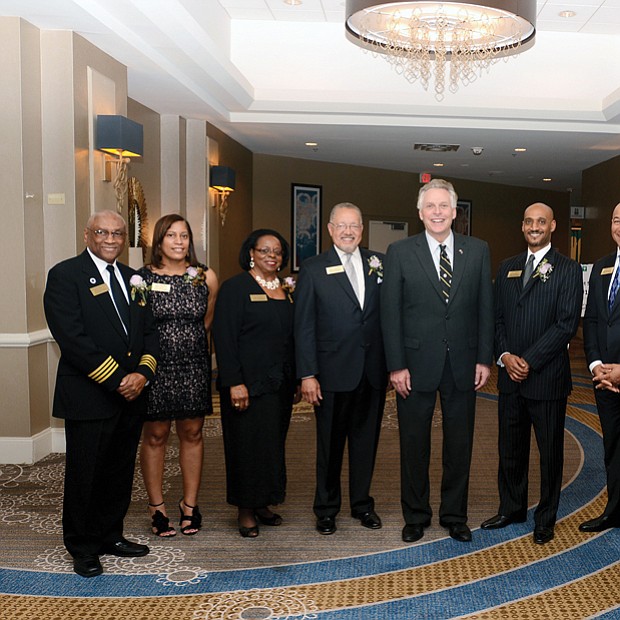 2017 Strong Men & Women honored //Seven high achievers were honored at the 2017 Strong Men & Women in Virginia History program Feb. 1 at a Downtown hotel. 
Gov. Terry McAuliffe, center, celebrates with the honorees during the annual event that Dominion Resources and the Library of Virginia co-sponsor to honor African-American standouts. 
From left, the honorees are: Capt. William E. “Bill” Bailey of Accomack, a decorated military pilot; Virginia Court of Appeals Judge Mary Janipher Bennett Malveaux of Henrico County, the court’s first African-American female member; Dr. Margaret Ellen Mayo Tolbert of Suffolk, influential biochemist and author; and Charles Johnson III, who accepted the award on behalf of his late grandfather, sociologist Charles Spurgeon Johnson of Bristol, the first African-American president of Fisk University.
Also, Optician David Lambert, representing his late father, Dr. Benjamin J. Lambert III of Richmond, a former state senator and optometrist who played a major role in civic affairs; Jeffrey Moten, who honored the memory of his late wife, Stephanie Therese Rochon-Moten of Richmond, award-winning television reporter and news anchor; and Zakia Al-Amin, who stood in for her grandfather, pioneering Virginia pharmacist Leonard “Doc” Muse of Arlington, who owned and operated Green Valley Pharmacy for 65 years. 