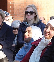 Supporters listen as U.S. Sen. Mark Warner, Congressman A. Donald McEachin of Henrico and Richmond area faith leaders call for support and solidarity for immigrants, refugees, religious freedom and diversity.   