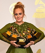 Adele confirms she's married by thanking 'husband' at the Grammys on February 12, 2017.