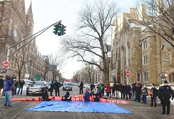 eople blocked an intersection during a demonstration on Friday in favor of changing the name of Yale’s Calhoun College. (PETER HVIZDAK / NEW HAVEN REGISTER, VIA ASSOCIATED PRESS)