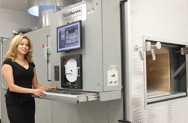 Funeral home’s new addition // Mia Mimms, president of Mimms Funeral Home, shows off the latest addition to her business — a state-of-the-art crematorium. The interior also includes a display of urns.