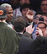 Basketball great Charles Oakley argues with a security guard before his arrest Feb. 8 at Madison Square Garden during an NBA game between the New York Knicks and the Los Angeles Clippers.