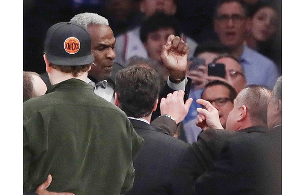 Basketball great Charles Oakley argues with a security guard before his arrest Feb. 8 at Madison Square Garden during an NBA game between the New York Knicks and the Los Angeles Clippers.