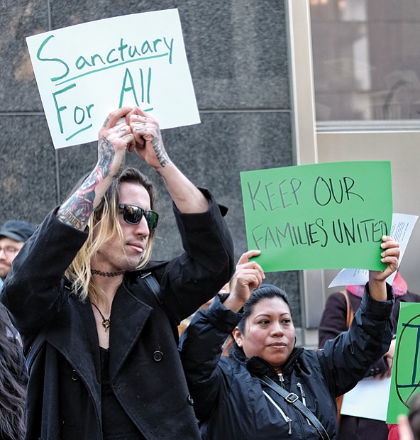 Rallying for ‘sanctuary’ // With signs and chants, more than 100 immigration advocates rally Monday afternoon outside City Hall to urge Richmond Mayor Levar M. Stoney and the Richmond City Council to declare Richmond a “sanctuary city” and defy stepped-up federal efforts to deport people who lack green cards or student, work or visitation visas. 
Later, advocates pushed their view during the public comment session of the evening’s council meeting.
So far, they have not moved government leaders, including the mayor, who has avoided using the “sanctuary” term. 
