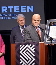 Dr. Maya Angelou's grandson Colin Johnson (right), Co-Founder and Principal of Caged Bird Legacy, LLC, presented Secretary Hillary Rodham Clinton (left) and President Bill Clinton (center) with a plaque of Dr. Maya Angelou's inauguration poem, "On The Pulse of Morning," that flew on the Orion Exploration Flight Test-1 (EFT-1) December 5, 2014.
Credit: Joseph Sinnott/©2017 WNET
