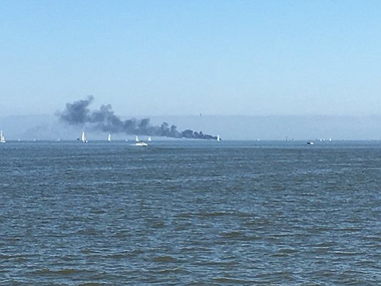 The U.S. Coast Guard says two people were rescued after a 45-year-foot pleasure craft caught fire near Bacliff.