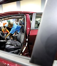 Ready to ride //
Landon Johnson, 4, left, gets a few pointers about choosing the right ride from his 10-year-old brother, Elijah, as they check out the interior of a sporty 2017 Toyota Corolla XSE last Saturday at the Virginia International Auto Show. The event that features hundreds of vehicles from various manufacturers, test drives and family fun was held at the Greater Richmond Convention Center in Downtown.