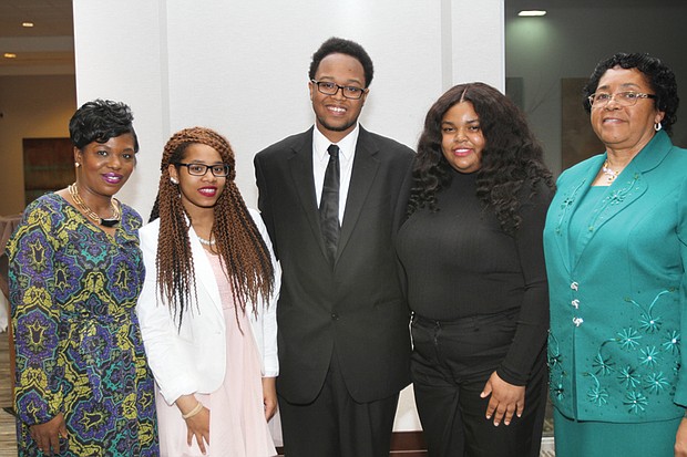 
President Rahmah T. Johnson, left, and Edwina Richmond, right, scholarship committee chair of the Virginia Area Chapter of Pi Lambda Theta International Honor Society and Professional Association in Education, with student winners, from left, Jaelynn Scott, DaRon Lightfoot and Ericka Black.