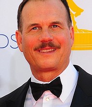 Actor Bill Paxton, from the History Channel's miniseries "Hatfields & McCoys", walks the red carpet before attending the 64th Annual Primetime Emmy Awards in Los Angeles, California.