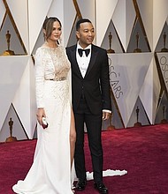 	Chrissy Teigen and John Legend