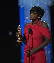 Viola Davis becomes the first African-American to win an Oscar, Tony, and Emmy for acting. Whoopi Goldberg was the first African-American to win an Oscar, Tony, and Emmy. Goldberg's Tony was for producing