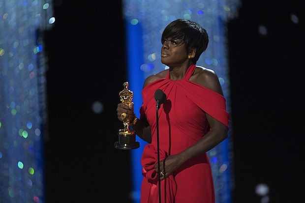 Viola Davis becomes the first African-American to win an Oscar, Tony, and Emmy for acting. Whoopi Goldberg was the first African-American to win an Oscar, Tony, and Emmy. Goldberg's Tony was for producing