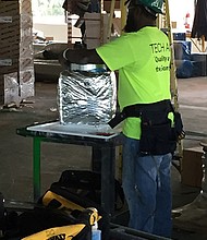 Mike Barnes installs duct work, a skill he’ll use in the construction of the MUSC Shawn Jenkins Children’s Hospital. The Medical University of South Carolina, located in Charleston, is on target to spend in the $12 million range with African-American owned businesses during the first two construction phases of this roughly $385 million project.