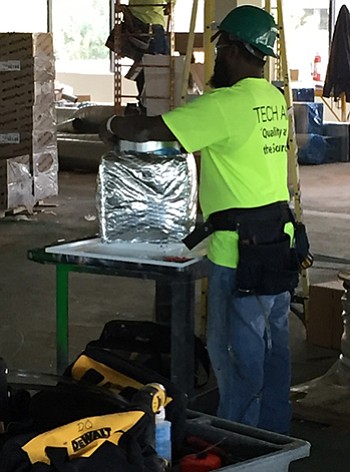 Mike Barnes installs duct work, a skill he’ll use in the construction of the MUSC Shawn Jenkins Children’s Hospital. The Medical University of South Carolina, located in Charleston, is on target to spend in the $12 million range with African-American owned businesses during the first two construction phases of this roughly $385 million project.