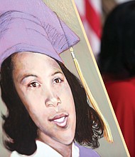 
Joan Johns Cobbs, right, listens as Gov. Terry McAuliffe delivers remarks during a dedication ceremony for the Barbara Johns Building, named for her sister, pictured in the portrait, left, in the building’s lobby at 202 N. 9th St. 