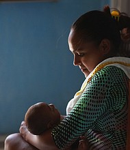 A Brazilian mother, Rafela Santos, is seen here holding her son Luiz Felipe on January 26, 2016 in Recife, Brazil. Her son was born with microcephaly.