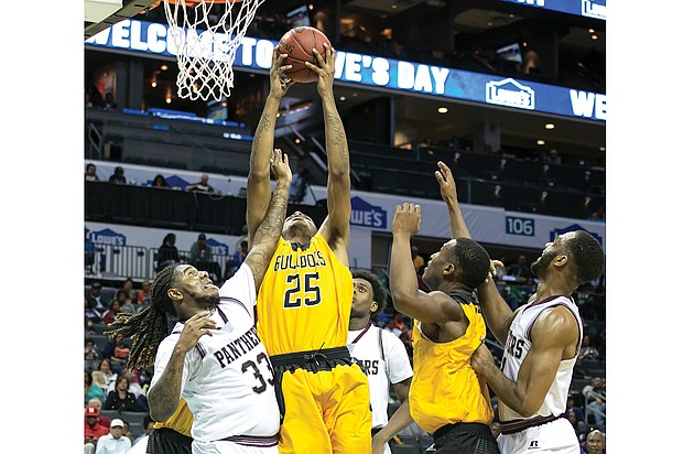 
Bowie State University’s Yohance Fleming goes up for a basket against Virginia Union University’s Tavon Mealy, left, during last Thursday’s quarterfinal game at the CIAA Tournament. Bowie State knocked VUU out of the tournament, defeating the Panthers 84-78. The Bulldogs went on to win the tournament 62-54 over Fayetteville State University.