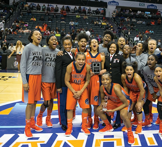 The Virginia State University women’s basketball team celebrates last Friday after making it to the CIAA finals
