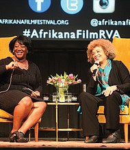 Scholar and activist Angela Y. Davis, right, and Tressie McMillan Cottom, a Virginia Commonwealth University assistant professor, react to a member of the audience during Dr. Davis’ appearance last Friday as the Afrikana Independent Film Festival’s 2nd Annual “Evening with an Icon.”