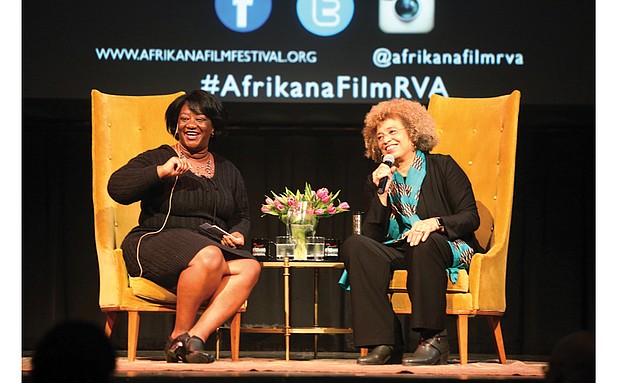 Scholar and activist Angela Y. Davis, right, and Tressie McMillan Cottom, a Virginia Commonwealth University assistant professor, react to a member of the audience during Dr. Davis’ appearance last Friday as the Afrikana Independent Film Festival’s 2nd Annual “Evening with an Icon.”