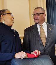 Norfolk Delegate Daun S. Hester chats with Delegate Luke E. Torian of Dumfries.