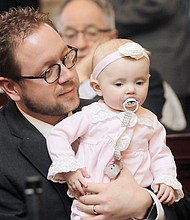 Delegate Joseph R. Yost of Pearisburg proudly shows the House chamber to Virginia, his 7-month-old daughter.