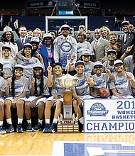 The Johnson C. Smith Golden Bulls women’s team celebrates its tournament title and 68-59 victory over the Virginia State University women’s team.