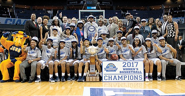 The Johnson C. Smith Golden Bulls women’s team celebrates its tournament title and 68-59 victory over the Virginia State University women’s team.