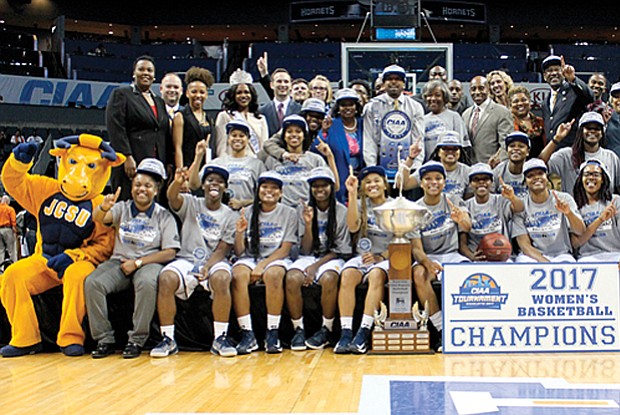 The Johnson C. Smith Golden Bulls women’s team celebrates its tournament title and 68-59 victory over the Virginia State University women’s team.