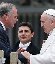 
U.S. Sen. Tim Kaine talks with Pope Francis during a general audience Feb. 21 at the Vatican.