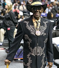 
Mr. CIAA, Abraham “Ham” Mitchell of Suffolk, sports one of his custom outfits around the arena in Charlotte. The colors are those of the Bowie State Bulldogs.