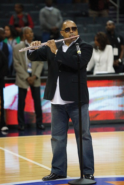 Jazz artist Najee performs the national anthem before last Saturday’s championship game.