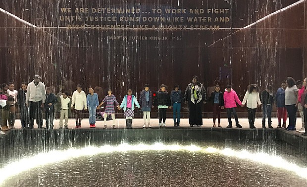 Photo courtesy of the Congressional Black Caucus Foundation //
Immersed in history //

Fifth-graders from Richmond’s Carver Elementary School join Principal Kiwana S. Yates and teachers around an indoor fountain at the Smithsonian National Museum of African American History and Culture in Washington. The students also visited the Congressional Black Caucus Foundation, which hosted the Feb. 22 trip in partnership with The New Y-CAPP, Youth Challenged Advised & Positively Promoted. At the foundation, they learned about efforts to advance the global black community and the separate work of members of the Congressional Black Caucus. The goal of the trip: To enable the students to gain a better understanding of the contributions of African-Americans. 
