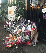 The collection of flowers, cards and candles continues to grow outside George Michael's north London home December 27th, 2016. The singer died on Christmas Day 2016 of suspected heart failure at the age of 53.