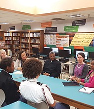 Those involved with the project include, forefront left to right, Franklin Military Academy students Lil’Meal Boyd, Saki Nowacki, Shakiyah Bolden-Jones and Alyssa Brown. Also, rear left to right, teacher Megan Scott, Principal Sheron Carter-Gunter, Commandant Carlton Day, teacher Danielle Bowers and Sen. Tim Kaine’s Central Virginia regional director, Tyee Mallory. Col. Day and Ms. Mallory are not traveling to England.  