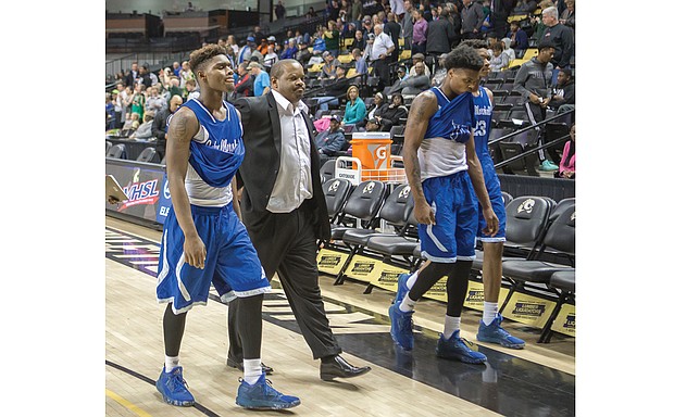 
John Marshall High Coach Ty White, above, walks to the locker room with his dejected ballplayers after the Justices’ 72-59 loss March 2 to Roanoke’s Northside High School during a quarterfinal game at the state 3A tournament at the Siegel Center. At right, George Wythe High’s Antonio Bridy snags the ball during the Bulldogs’ victorious quarterfinal match against Heritage High School of Lynchburg on March 2. The Bulldogs fell to I.C. Norcom High School of Portsmouth during the semifinals on March 3. 