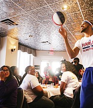 Zeus plays to crowd at Mama J’s //

Zeus McClurkin, a member of the legendary Harlem Globetrotters basketball team, captivates the room of 37 George Wythe High School honor students during a special luncheon Wednesday honoring the young people at Mama J’s Kitchen in Jackson Ward. The Columbus, Ohio, native engaged the students with a pep talk before showing off his skills. The event was part of Richmond’s first Black Restaurant Week highlighting black-owned and operated restaurants in the city. The promotion, with fixed-price lunch and dinner specials at 20 restaurants, runs through Sunday, March 12. Mr. McClurkin and the Harlem Globetrotters have an exhibition game 7 p.m. Friday, March 10, at the Richmond Coliseum.