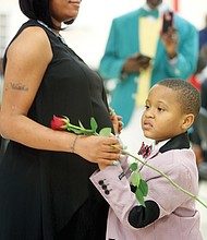 First dance
Keon Pleasant, 6, shares a first dance with his mother, Quaneisha Tyler, at the Mother/Son, Father/Daughter Dance last Friday for J.L. Francis Elementary School students and their parents. The dance was held at Second Baptist Church on Broad Rock Boulevard, with youngsters presenting roses to their parents. Princes and princesses of the dance were crowned. Keon’s grandfather, Anthony Bailey, documents the special occasion in the background.