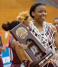 Virginia Union University’s Lady Walker poses with the victory trophy and net Monday night after the Lady Panthers defeated California University of Pennsylvania to win the NCAA Division II Atlantic Region title. Lady Walker scored 32 points in the regional championship game and was named to the All-Atlantic Region team.  