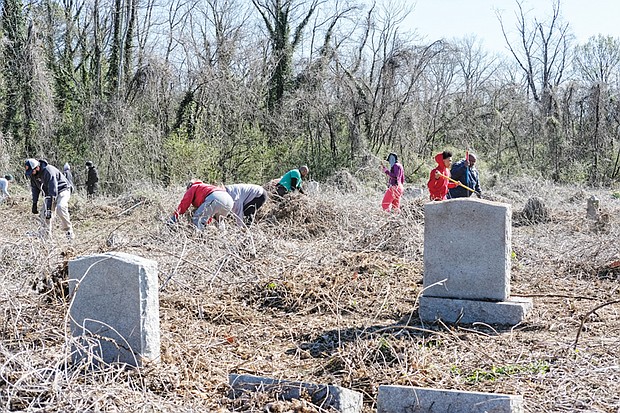 Hundreds of volunteers — and a few goats — responded last Saturday to a call to help spruce up historic, but long neglected, East End and Evergreen cemeteries where an estimated 17,000 African-Americans have been buried since the 1890s. Right, Tonya Jefferson snips uncontrolled vines that have taken over many of the gravesites where the likes of businesswoman and civic activist Maggie L. Walker and crusading newspaper editor and banker John Mitchell Jr. are interred. 