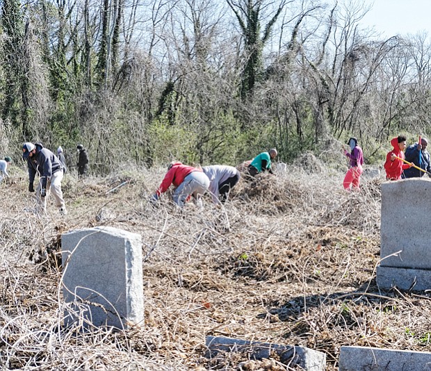Hundreds of volunteers — and a few goats — responded last Saturday to a call to help spruce up historic, but long neglected, East End and Evergreen cemeteries where an estimated 17,000 African-Americans have been buried since the 1890s. Right, Tonya Jefferson snips uncontrolled vines that have taken over many of the gravesites where the likes of businesswoman and civic activist Maggie L. Walker and crusading newspaper editor and banker John Mitchell Jr. are interred. 