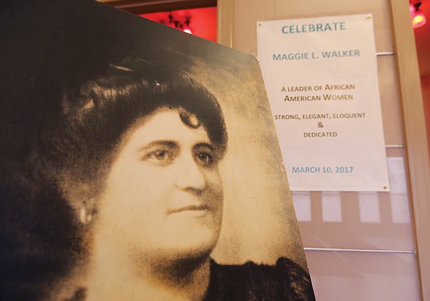 CITYSCAPE //A portrait of Richmond icon Maggie L. Walker, left, and a marquee message welcome people attending a celebration last Friday at the Hippodrome Theater in Jackson Ward. The “Dear Co Workers” event celebrated the team of volunteers who helped Heather Huyck, an adjunct history professor at the College of William & Mary, in a seven-year effort to preserve documents, letters and papers of Mrs. Walker and the mutual aid society she led and through which she founded a bank, a newspaper and a department store. The papers are now protected in 20 boxes that owners Margaret T. and Wanda D. Stallings hope to donate to the Smithsonian National Museum of African American History and Culture. 