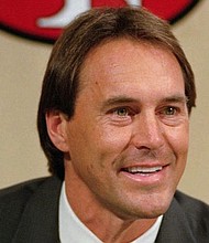 Former San Francisco 49ers executive Dwight Clark smiles during a news conference at the 49ers training camp in Santa Clara, Calif., Tuesday, Feb. 7, 1995. Clark played nine seasons as wide receiver for the 49ers from 1979-1987.