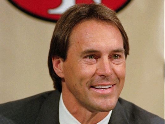 Former San Francisco 49ers executive Dwight Clark smiles during a news conference at the 49ers training camp in Santa Clara, Calif., Tuesday, Feb. 7, 1995. Clark played nine seasons as wide receiver for the 49ers from 1979-1987.