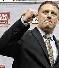 Virginia Commonwealth University’s new head basketball coach, Mike Rhoades, greets fans and the media Wednesday during his official public introduction at the Siegel Center. Rhoades, who was an assistant coach at VCU under former Coach Shaka Smart, is leaving the head coach role at Rice University to lead the Rams.