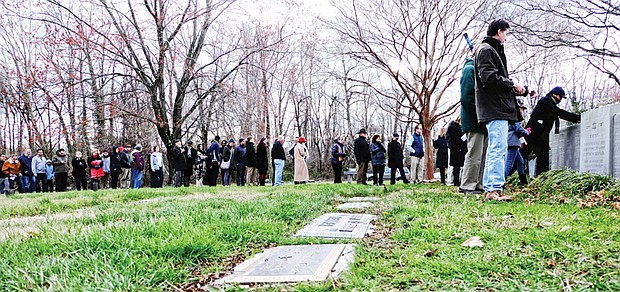 Standing together // In the wake of a rash of vandalism at Jewish cemeteries and community centers across the nation, more than 200 people attend a unity rally Sunday at Emek Sholom Holocaust Memorial Cemetery in Henrico County as a show of solidarity.
Speakers from several faith traditions participated in “Standing Together: Remember and Respond.” The event at the cemetery, located within Forest Lawn Cemetery, was designed to support those who have been targeted by recent events and to stand in unity against divisive and bigoted actions and rhetoric. 
Top, people line up to place stones on a monument to those who died in the Holocaust and whose remains were never found. Right, Ahmed Faried leaves stones on the site.

