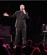 Bobby Z. speaks to the crowd during the “Official Prince Tribute-A Celebration of Life and Music,” concert at Xcel Energy Center on Oct. 13, 2016, in St. Paul, Minnesota. (Photo by Adam Bettcher/Getty Images)